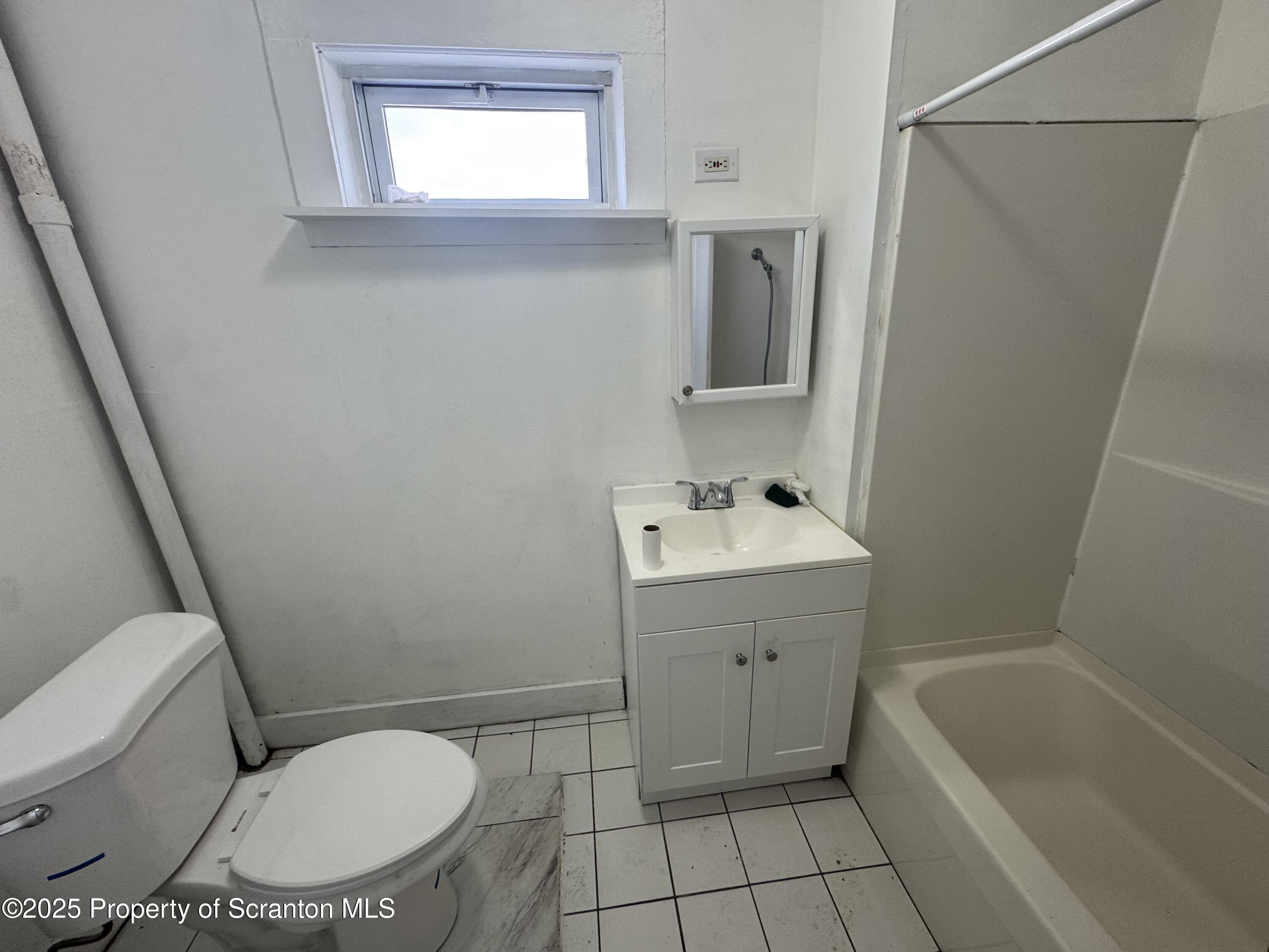 627 South Blakely Street Scranton, PA 18510 - Photo 8 of 13 a bathroom with a sink toilet and shower