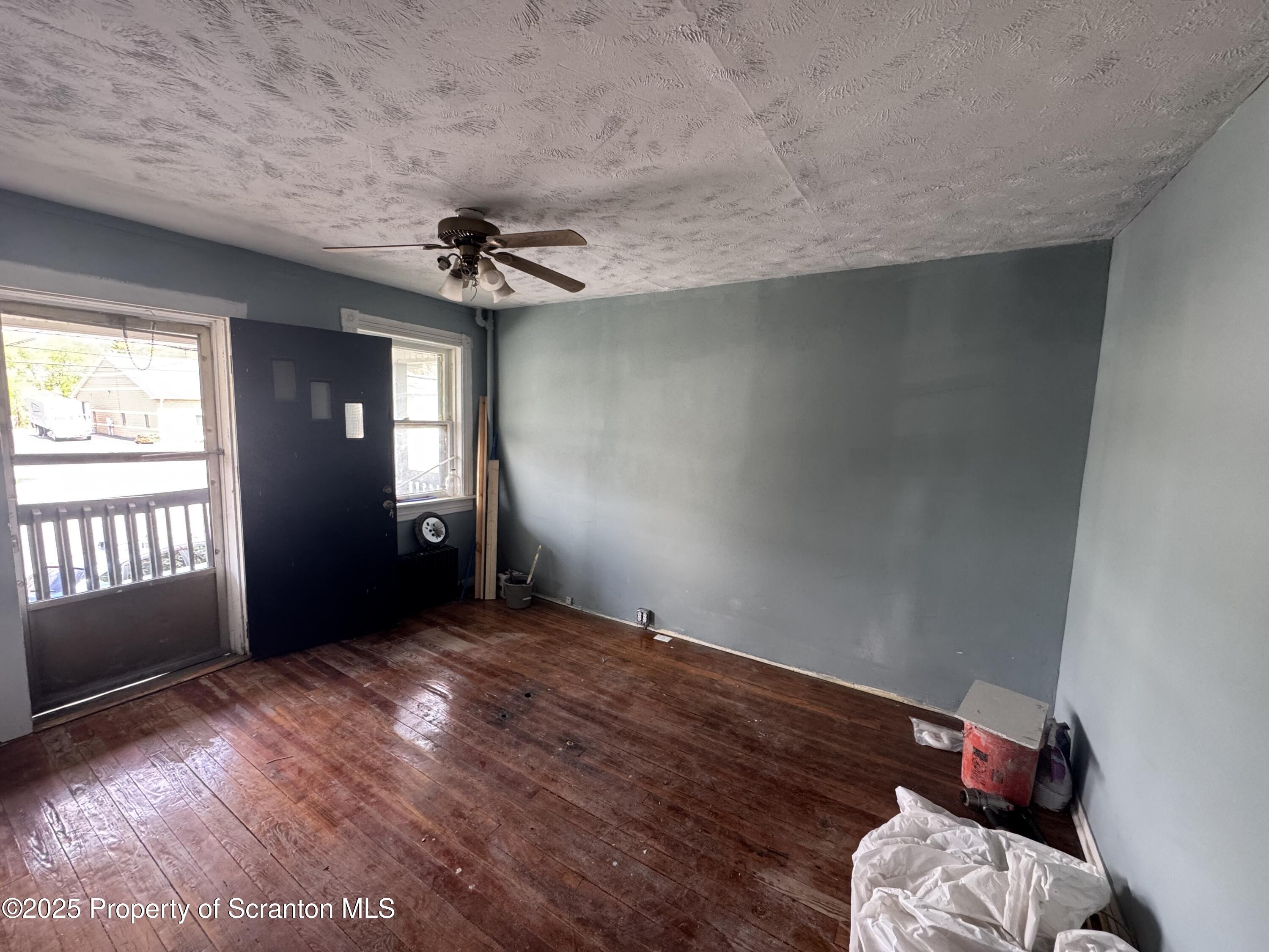 627 South Blakely Street Scranton, PA 18510 - Photo 10 of 13 wooden floor in an empty room with a window