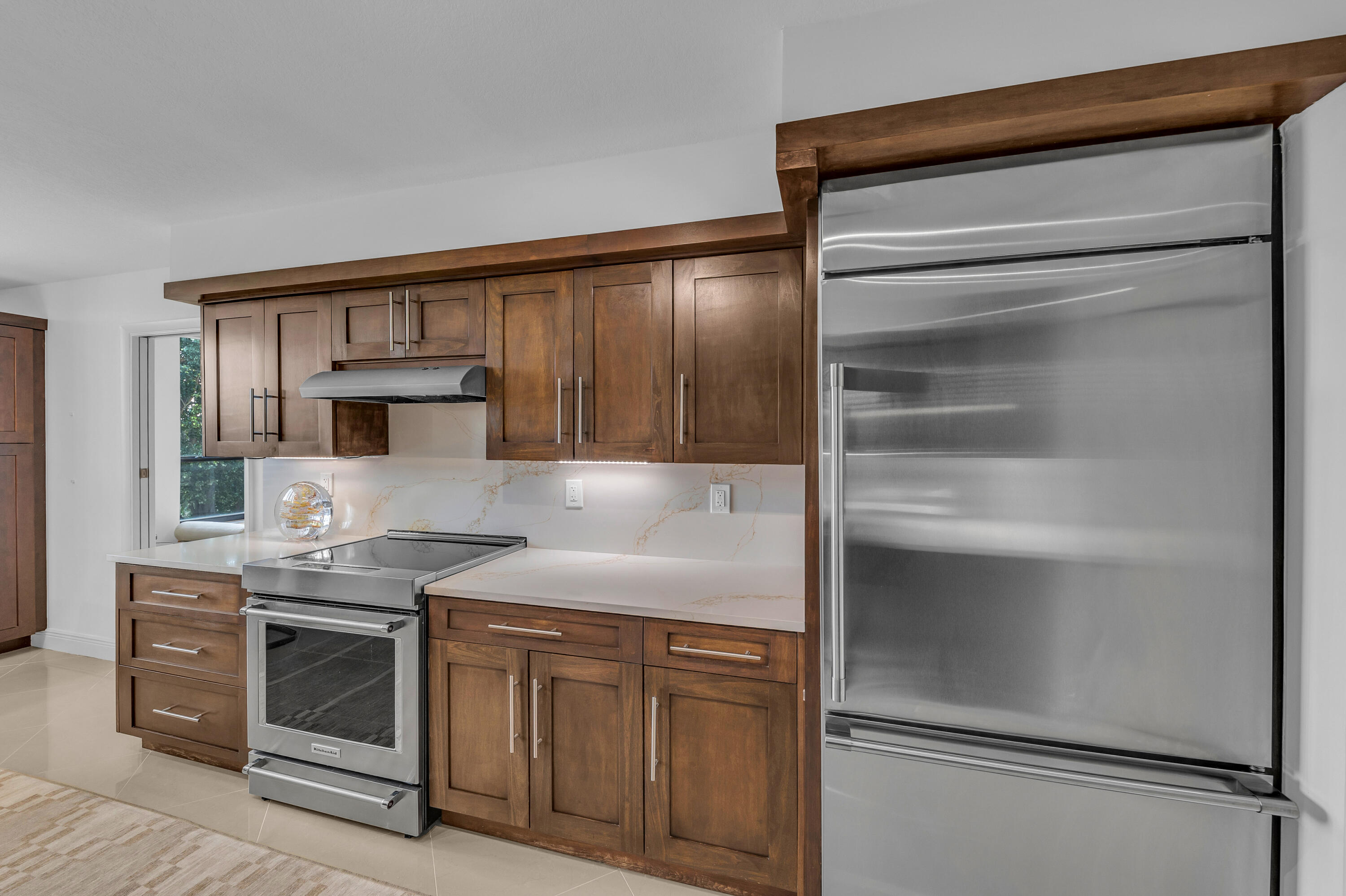 7572 Regency Lake Drive, Unit 402 Boca Raton, FL 33433 - Photo 14 of 31 a kitchen with stainless steel appliances granite countertop a refrigerator and a stove