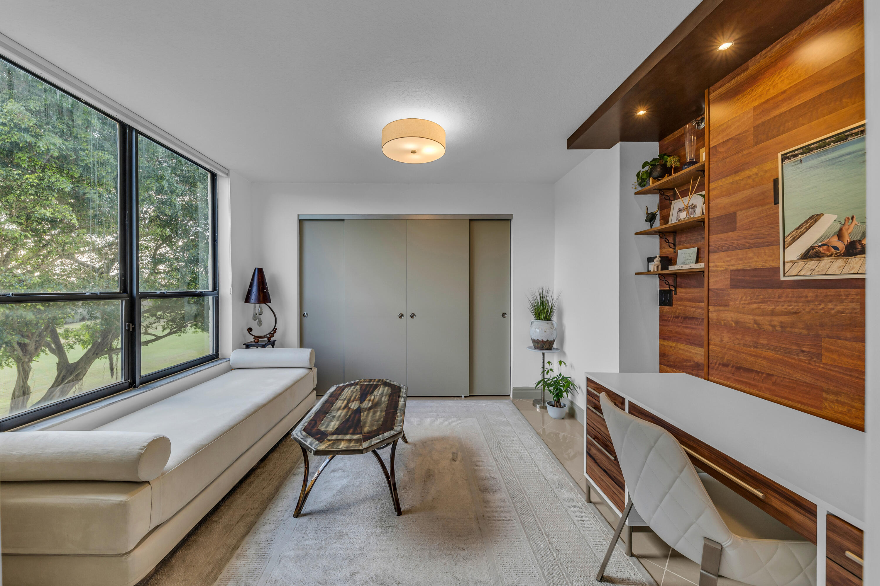 7572 Regency Lake Drive, Unit 402 Boca Raton, FL 33433 - Photo 18 of 31 a room with furniture and a window