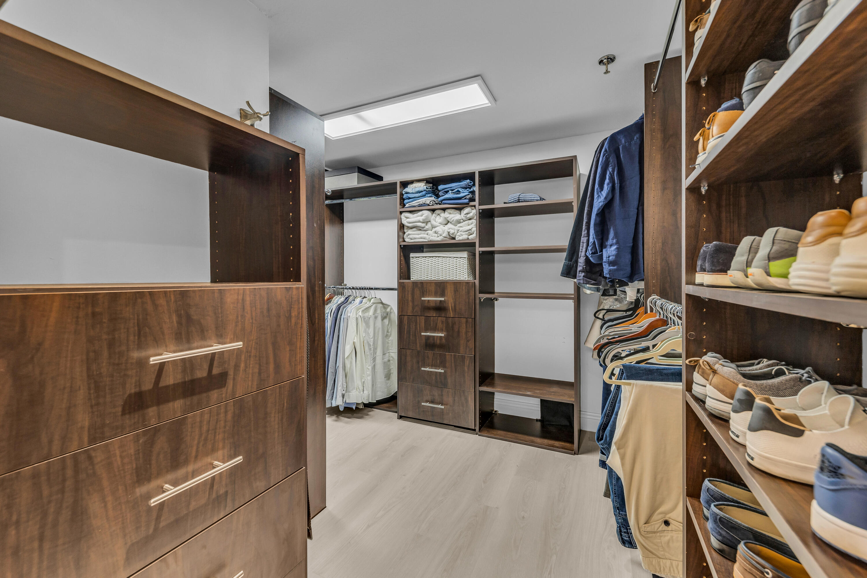 7572 Regency Lake Drive, Unit 402 Boca Raton, FL 33433 - Photo 23 of 31 a view of walk in closet