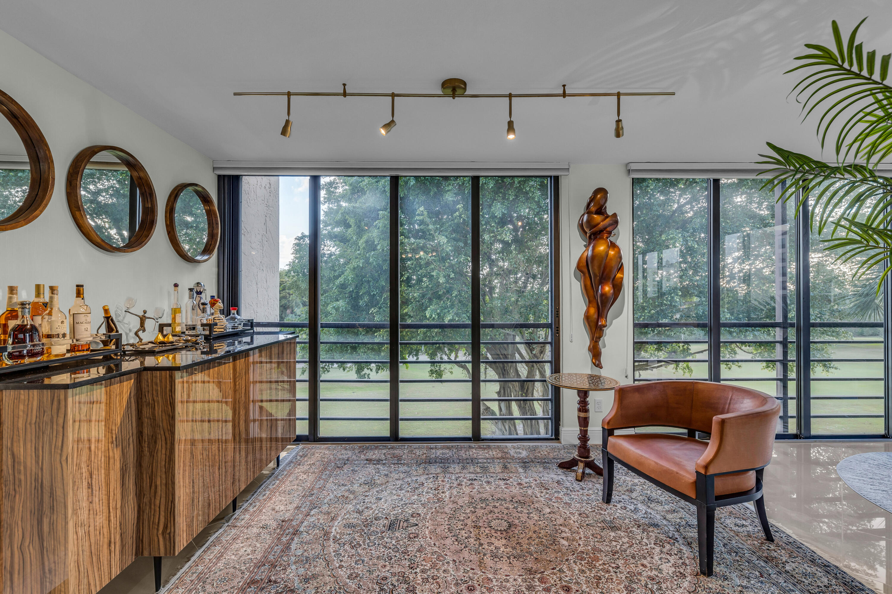 7572 Regency Lake Drive, Unit 402 Boca Raton, FL 33433 - Photo 7 of 31 a living room with furniture and a large window