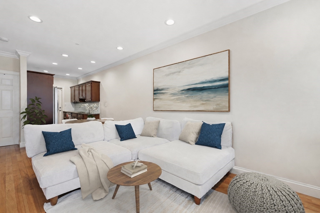 110 Chelsea Street, Unit 1 Boston, MA 02128 - Photo 2 of 12 a living room with furniture and a painting
