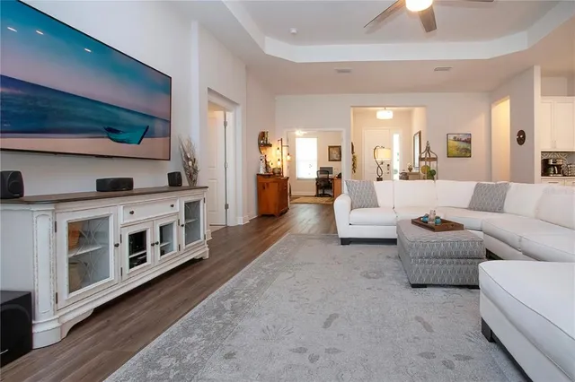 a kitchen with kitchen island granite countertop a sink stove and cabinets