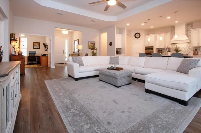 an aerial view of a house with garden space and lake view