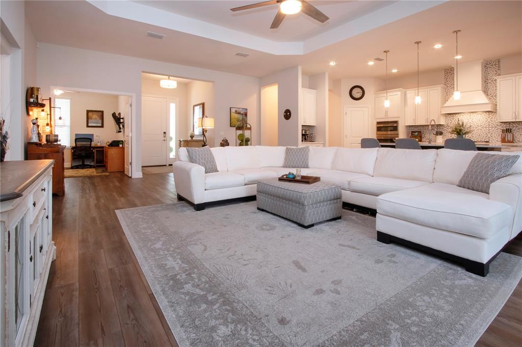 4304 Fly Rod Terrace Parrish, FL 34219 - Photo 3 of 97 a living room with furniture and a view of kitchen