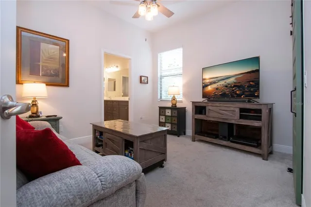 a dining room with furniture a window and wooden floor