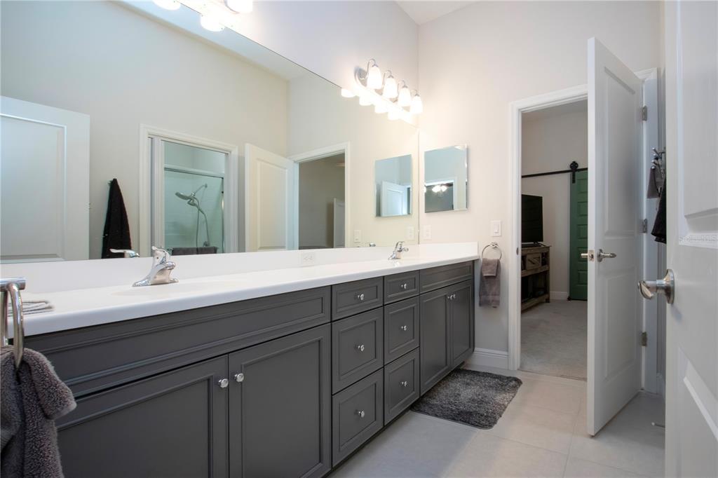 4304 Fly Rod Terrace Parrish, FL 34219 - Photo 44 of 97 a bathroom with a double vanity sink double and mirror