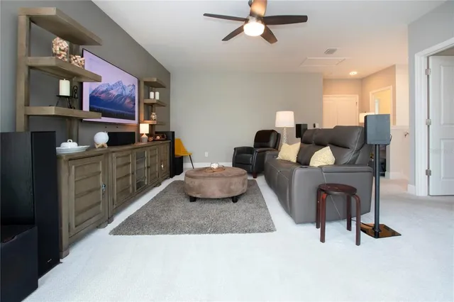 a swimming pool with outdoor seating and yard