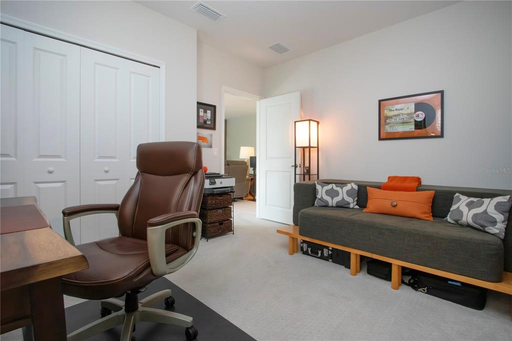 4304 Fly Rod Terrace Parrish, FL 34219 - Photo 53 of 97 a living room with furniture and a chair