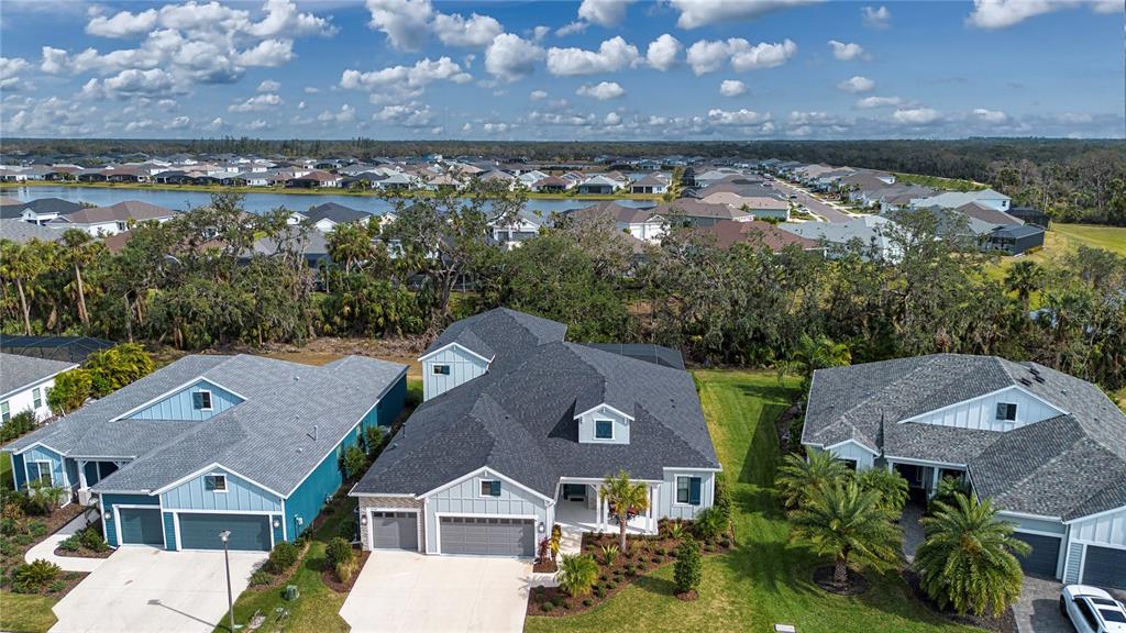 4304 Fly Rod Terrace Parrish, FL 34219 - Photo 7 of 97 an aerial view of a house with a lake view