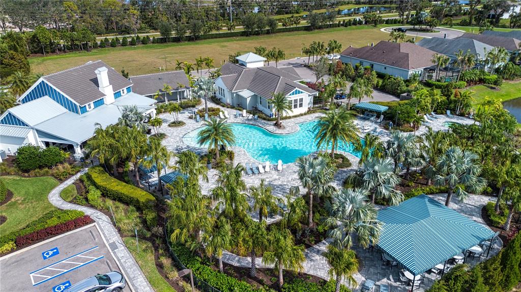 4304 Fly Rod Terrace Parrish, FL 34219 - Photo 71 of 97 an aerial view of a house with outdoor space and lake view in back