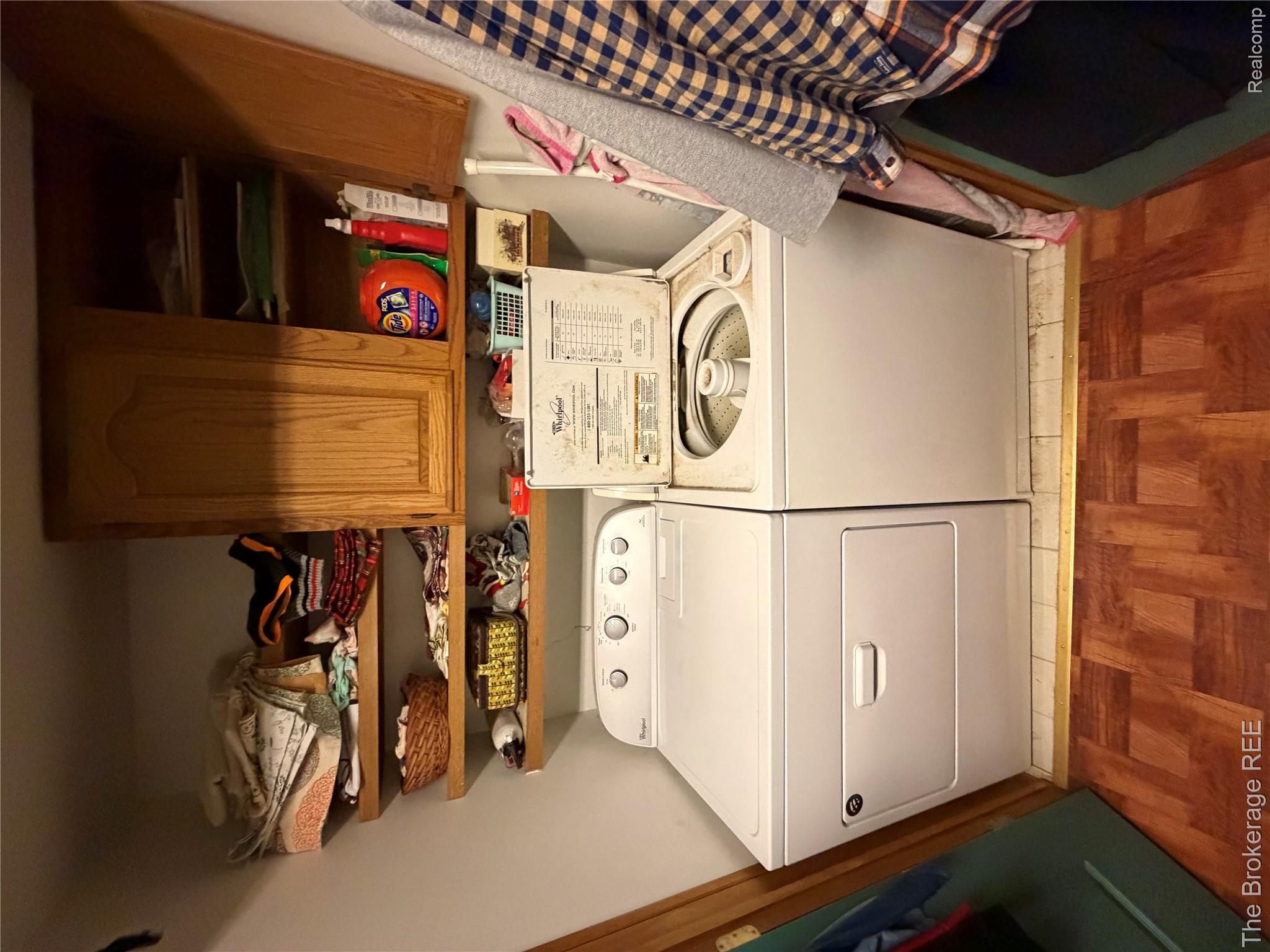 13405 Fagan Road Holly, MI 48442 - Photo 30 of 57 Laundry room featuring light wood-type flooring, washer and dryer, and cabinet space