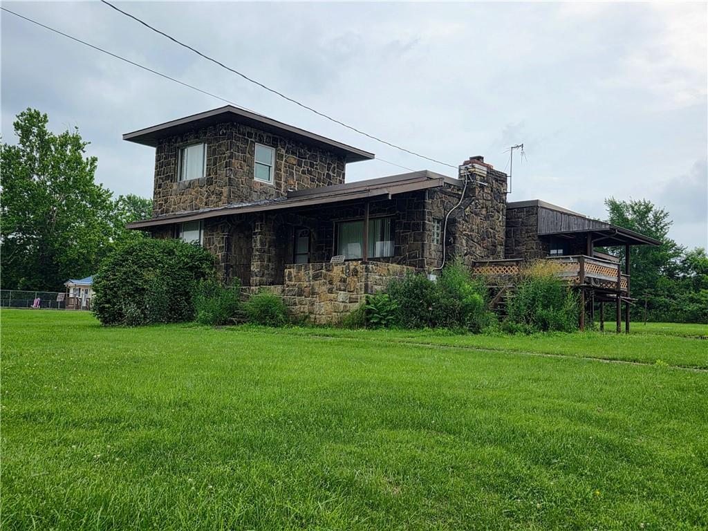 1356 Connellsville Road Lemont Furnace, PA 15456 - Photo 1 of 29 a front view of a house with a yard