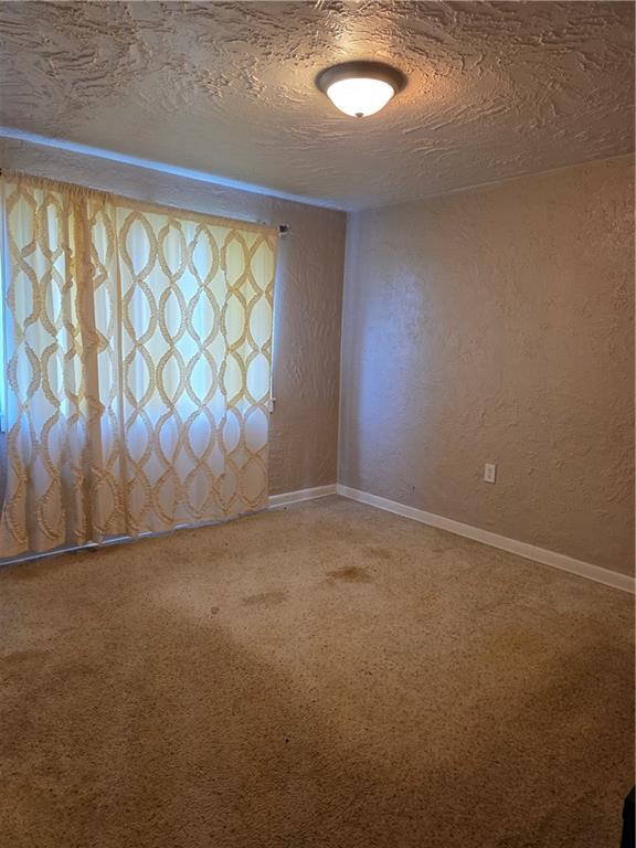 1356 Connellsville Road Lemont Furnace, PA 15456 - Photo 13 of 29 a view of an empty room with a window