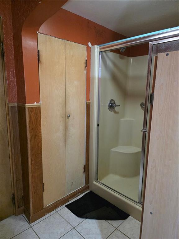 1356 Connellsville Road Lemont Furnace, PA 15456 - Photo 17 of 29 a bathroom with a glass shower door