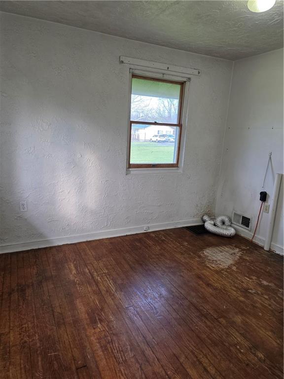 1356 Connellsville Road Lemont Furnace, PA 15456 - Photo 19 of 29 an empty room with wooden floor and windows