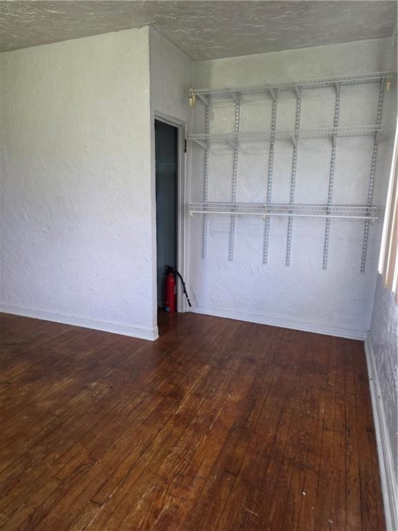 1356 Connellsville Road Lemont Furnace, PA 15456 - Photo 20 of 29 a view of an empty room with wooden floor