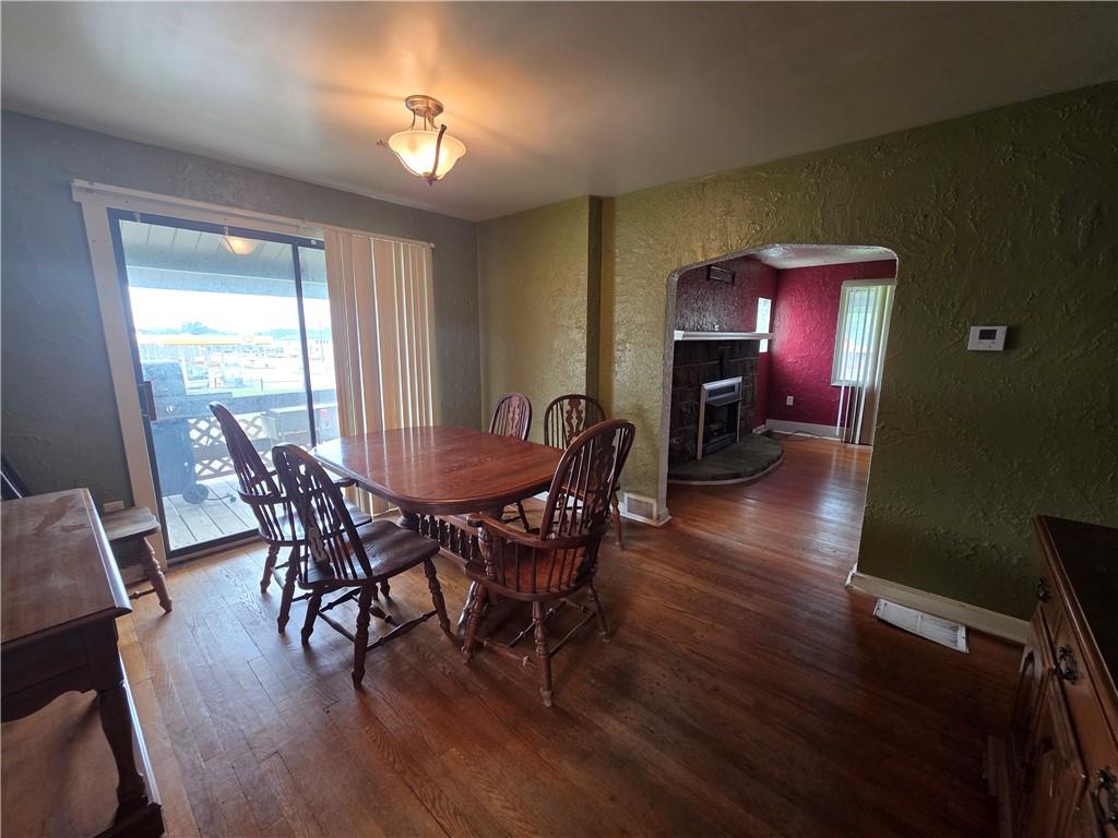 1356 Connellsville Road Lemont Furnace, PA 15456 - Photo 6 of 29 a view of a dining room with furniture and wooden floor