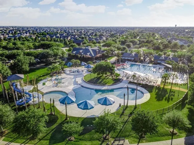 a view of swimming pool with a yard