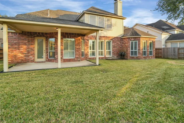 a view of a house with a garden and deck