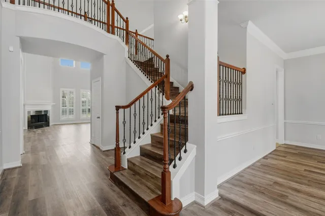 a view of entryway and hall with wooden floor