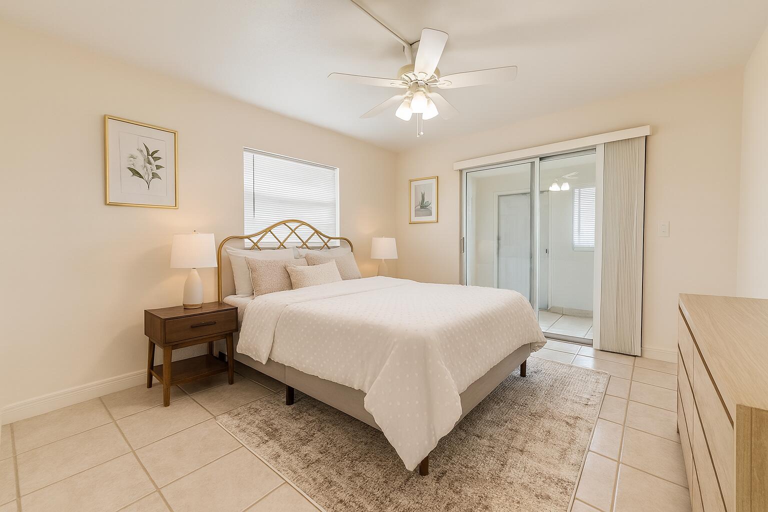 337 Saxony Lane Delray Beach, FL 33446 - Photo 13 of 26 a bedroom with a bed and a chandelier