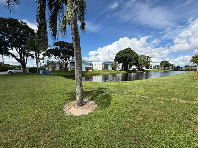 a view of a fountain in front of a house