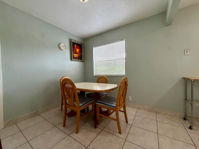 a work room with furniture and a window