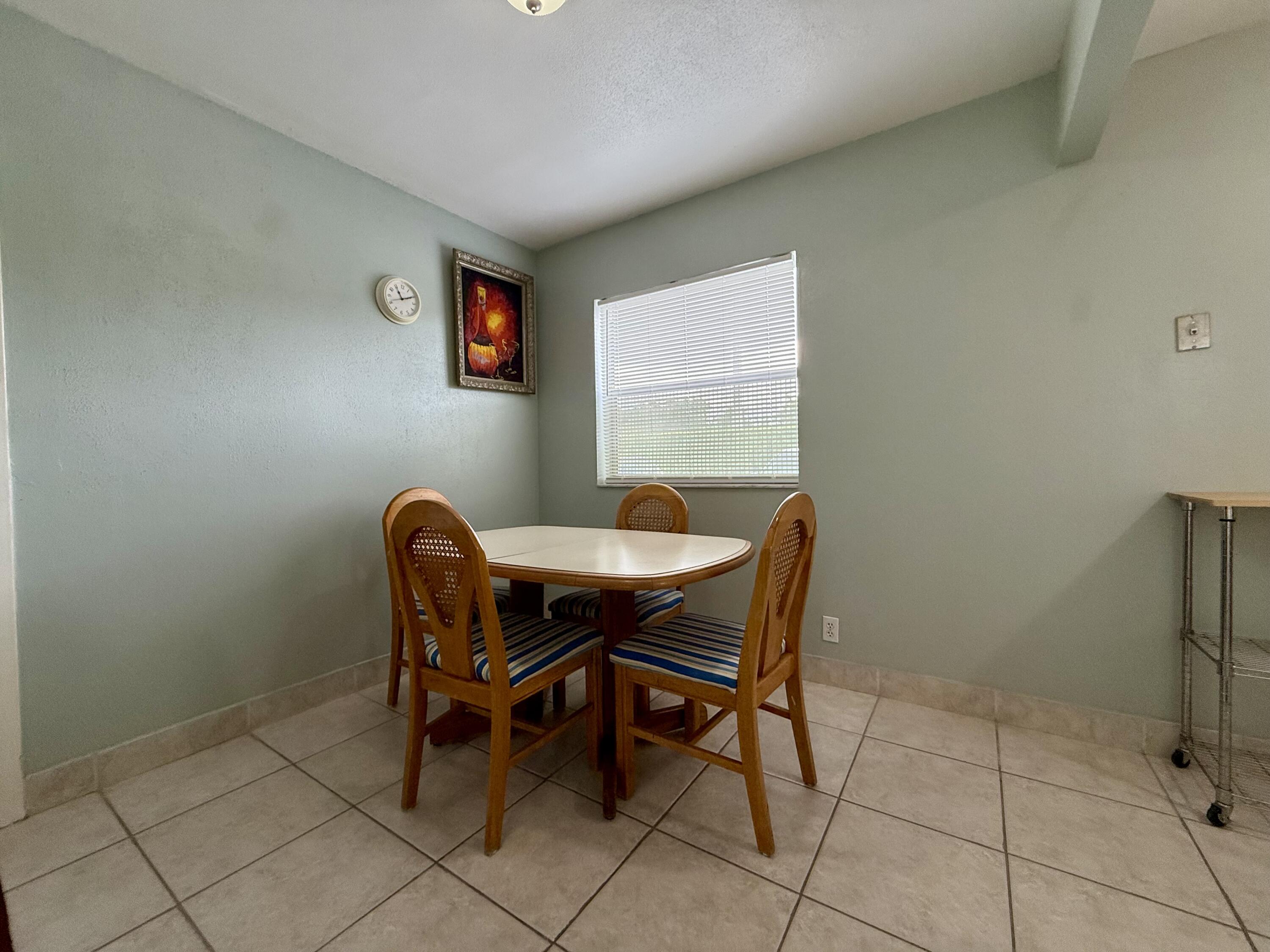 337 Saxony Lane Delray Beach, FL 33446 - Photo 4 of 26 a work room with furniture and a window