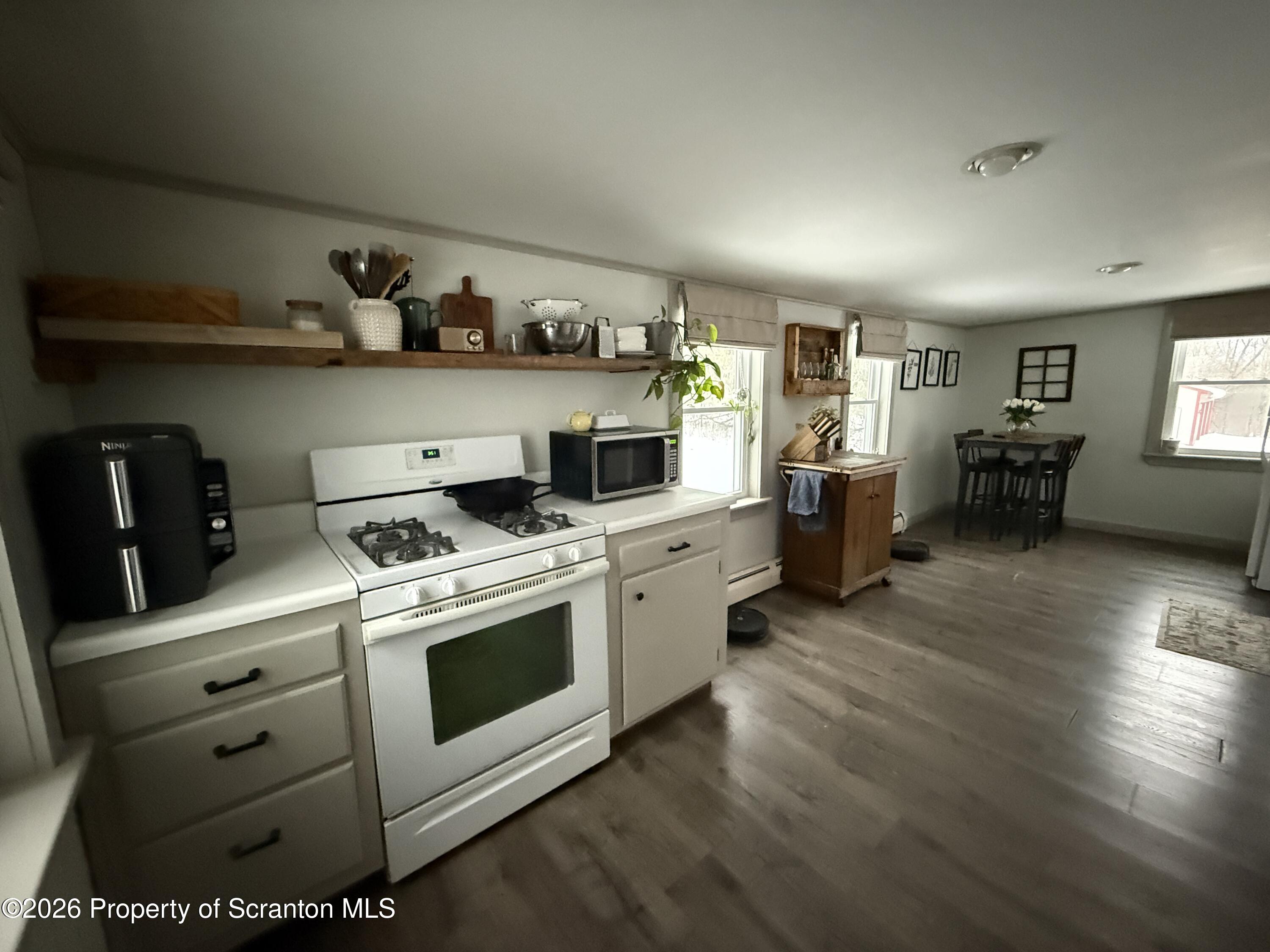 155 Hickory Hill Road Starrucca, PA 18462 - Photo 13 of 46 a kitchen with stainless steel appliances granite countertop a stove and cabinets