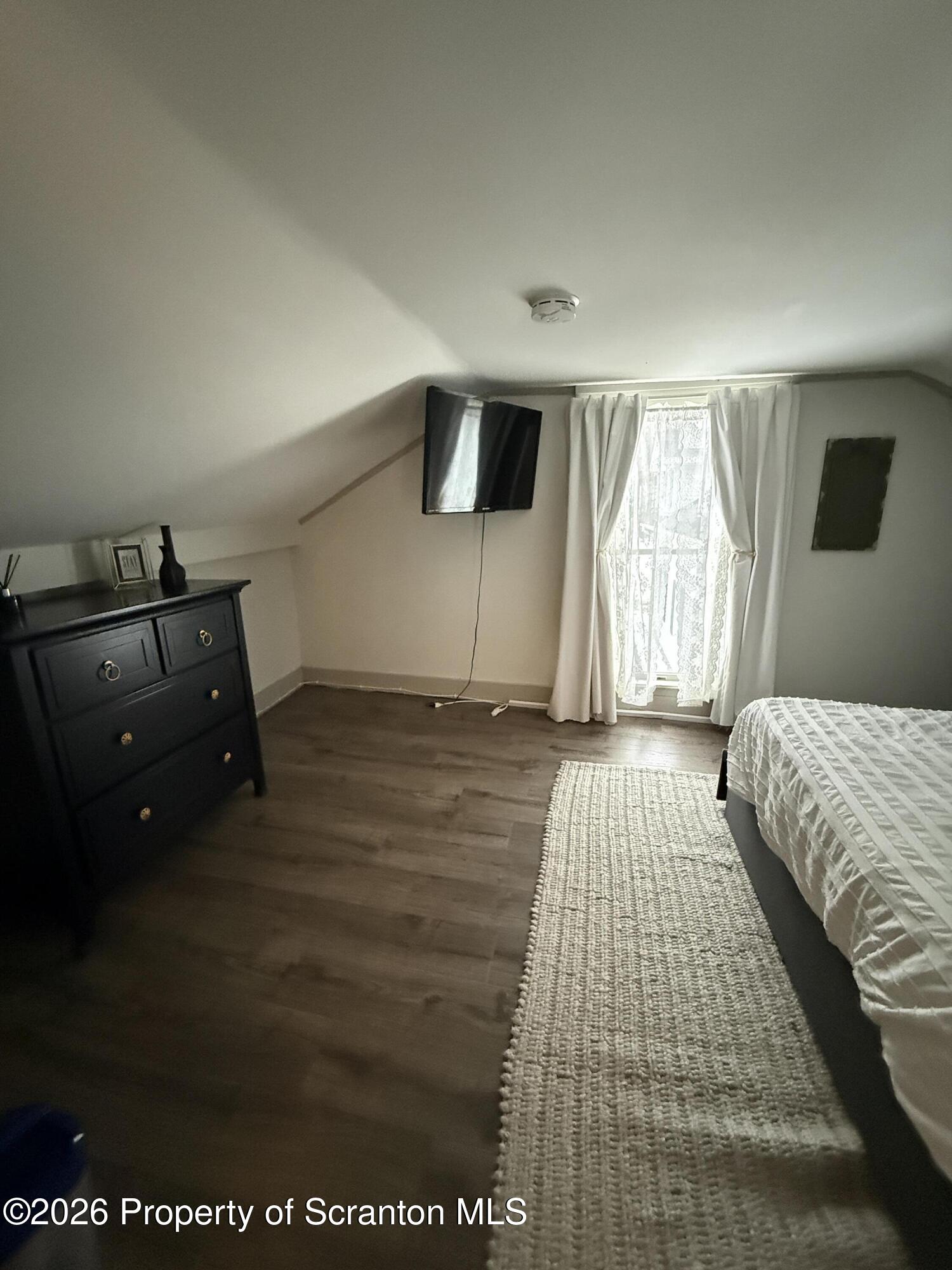 155 Hickory Hill Road Starrucca, PA 18462 - Photo 18 of 46 a bedroom with a bed and window