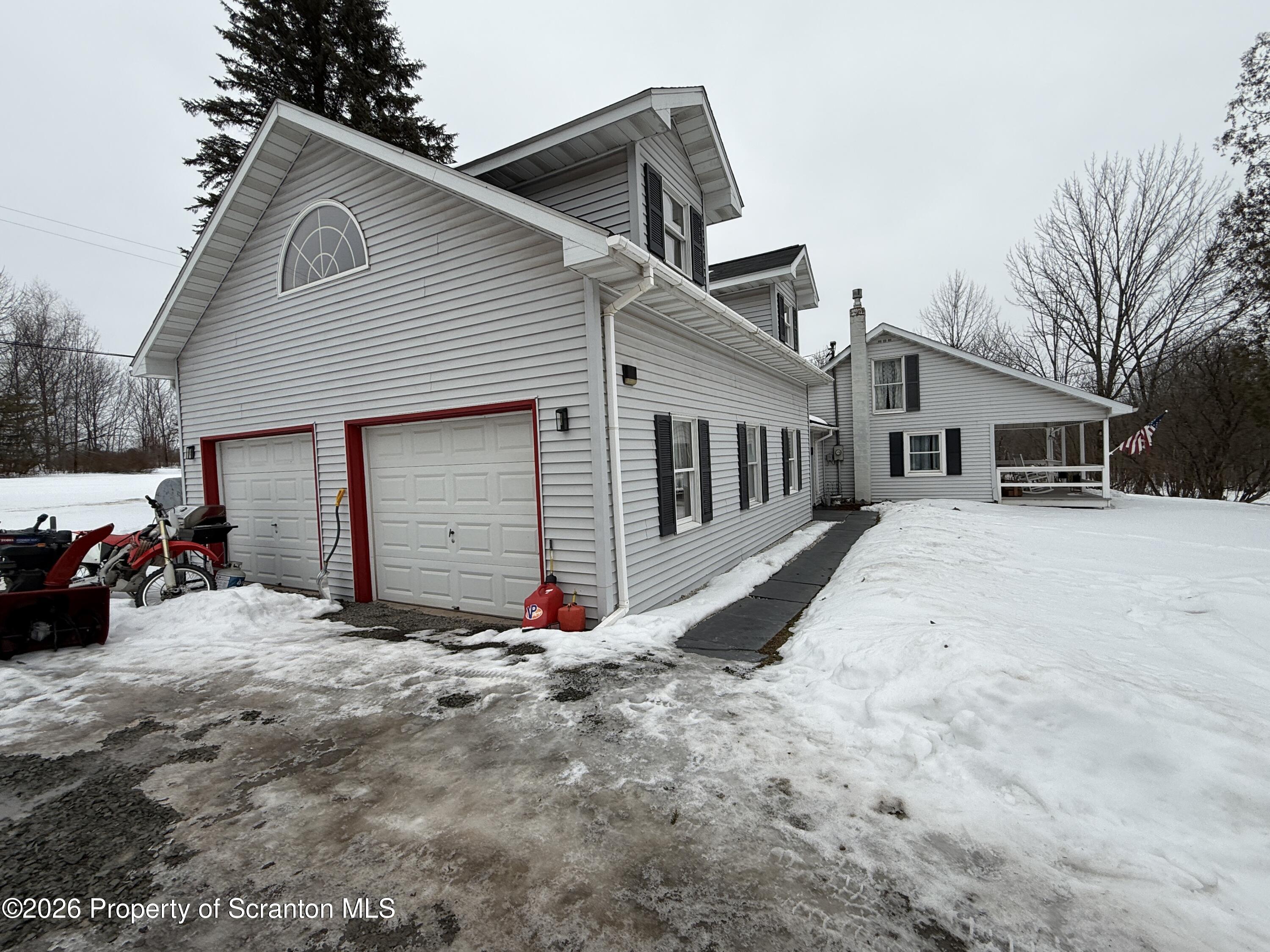155 Hickory Hill Road Starrucca, PA 18462 - Photo 2 of 46 a view of a house with a yard and parking space