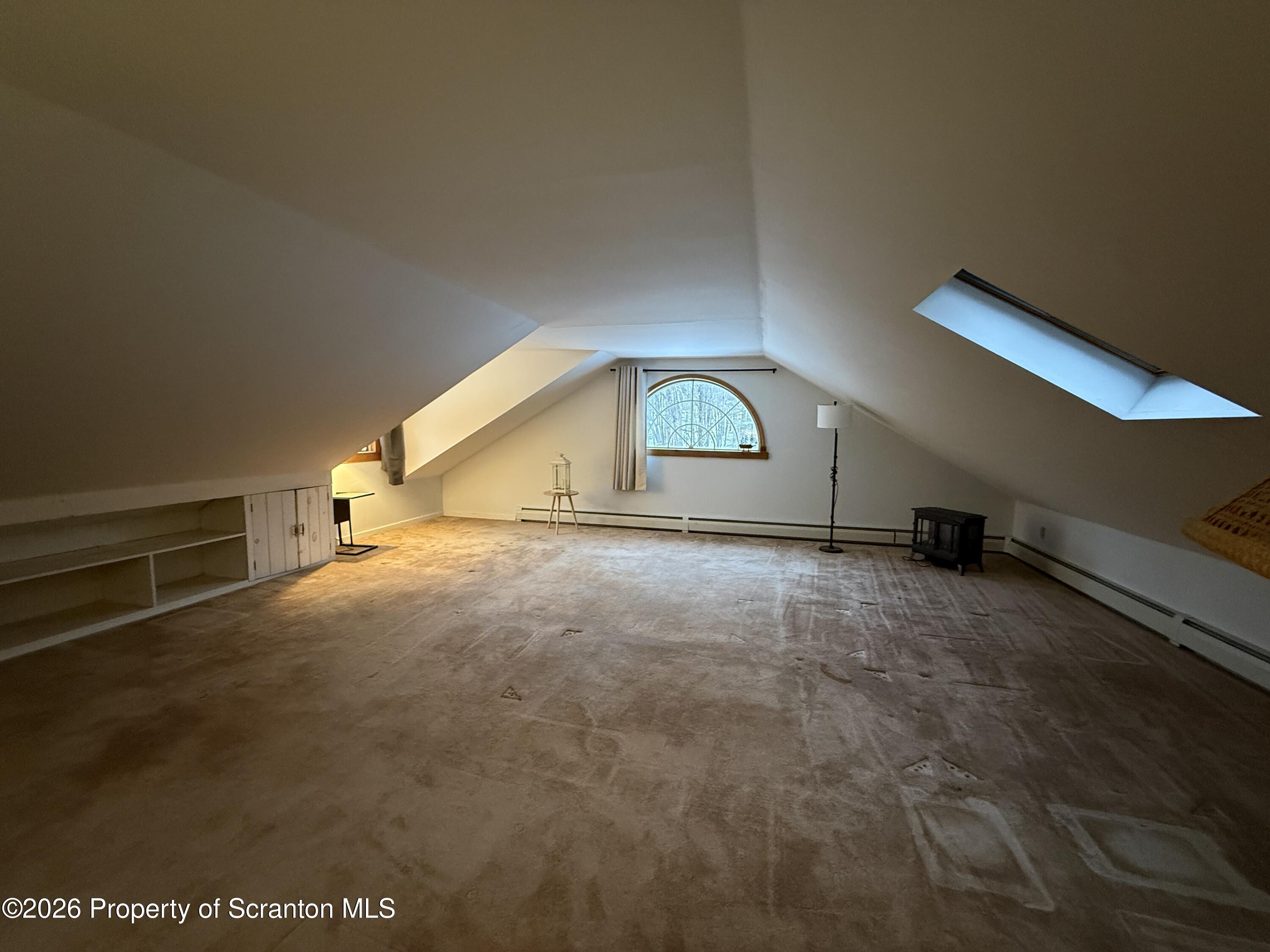 155 Hickory Hill Road Starrucca, PA 18462 - Photo 31 of 46 a view of a livingroom with an empty space and a window