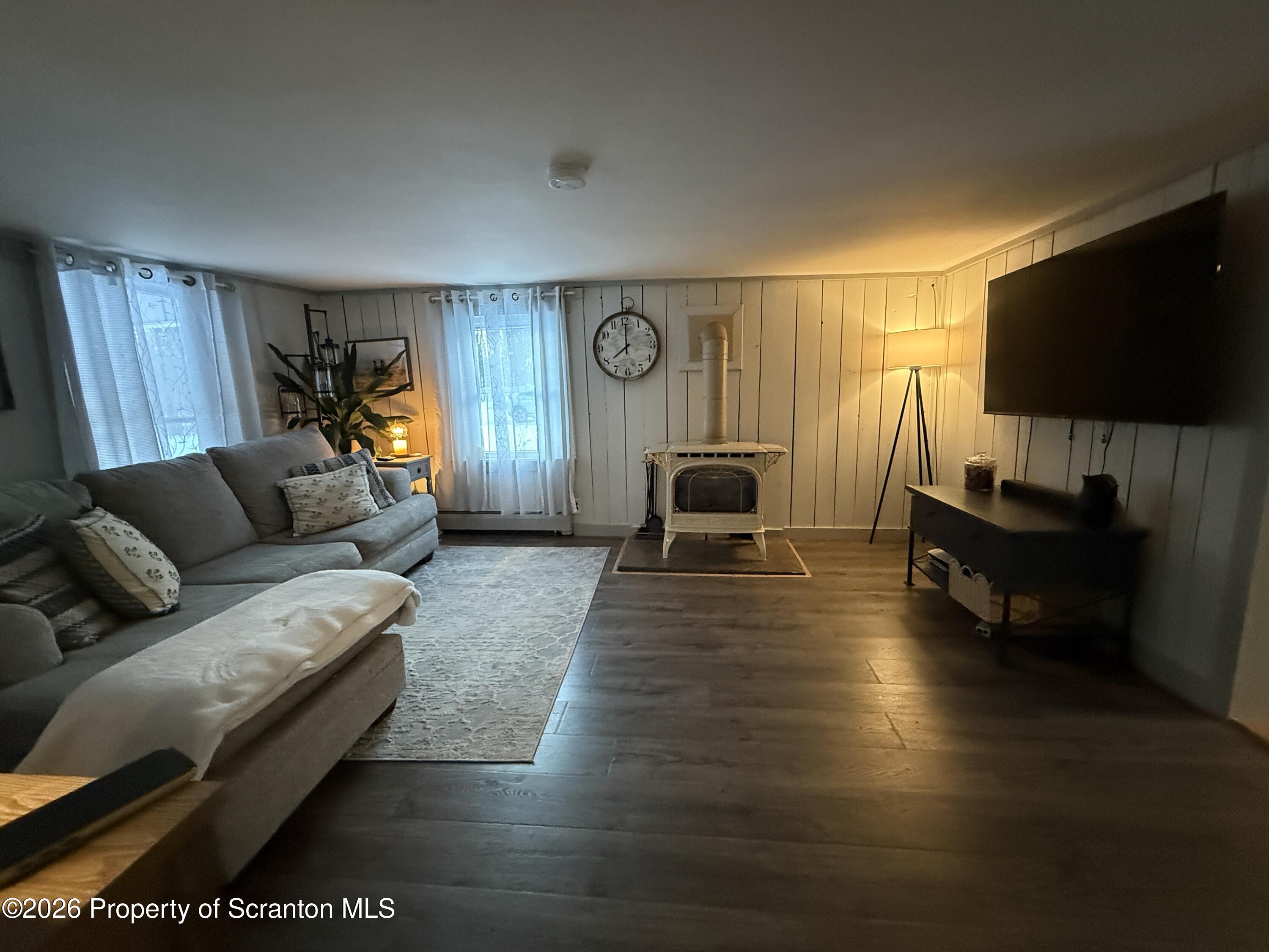 155 Hickory Hill Road Starrucca, PA 18462 - Photo 6 of 46 a living room with furniture and a flat screen tv
