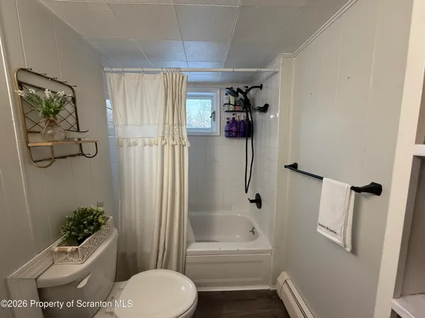 a bedroom with a large bed and a walk in closet