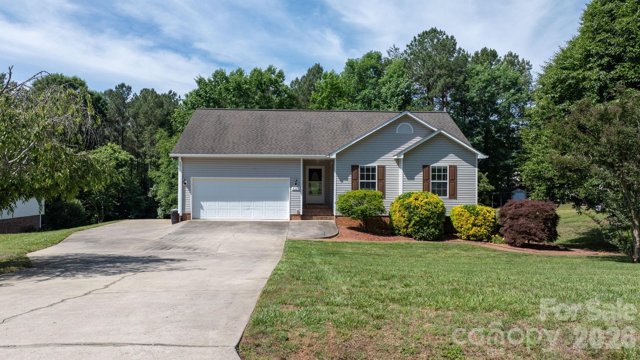 4967 Addison Lane Hickory, NC 28601 - Photo 25 of 43 a front view of a house with a yard and garage