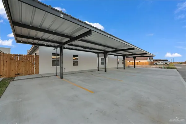 a front view of a house with a garden and yard