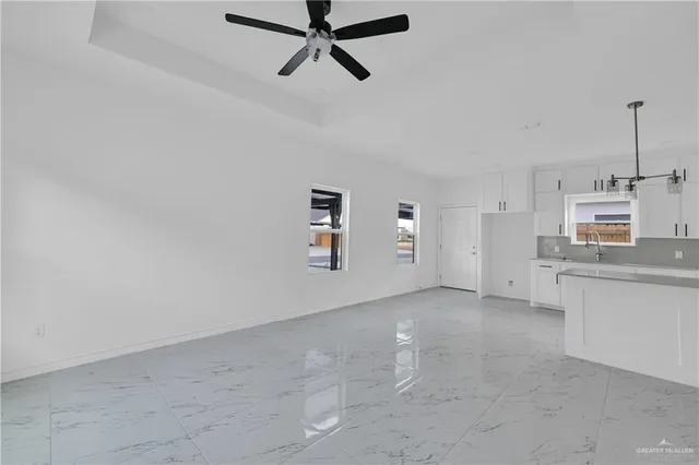 a view of a kitchen with microwave and dishwasher