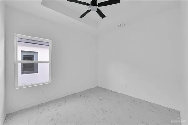 a view of a room with rack and window