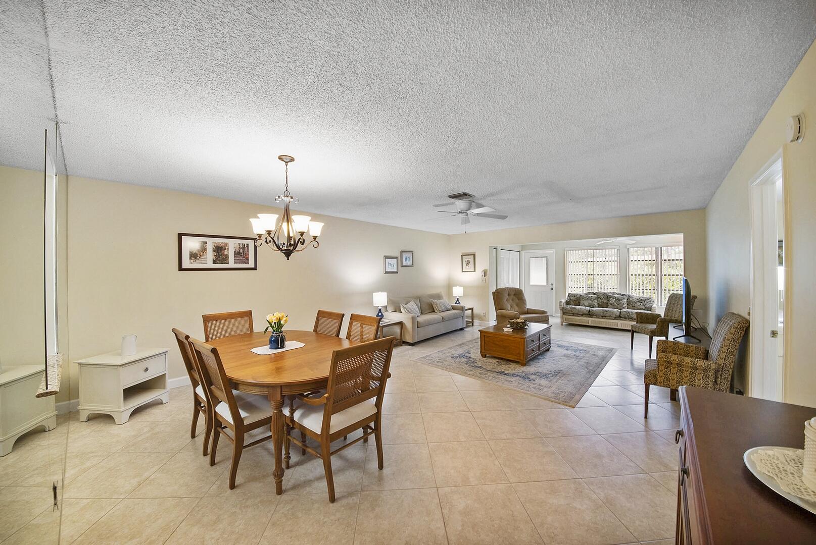 5222 Privet Place, Unit B Delray Beach, FL 33484 - Photo 27 of 27 a dining room with furniture and wooden floor