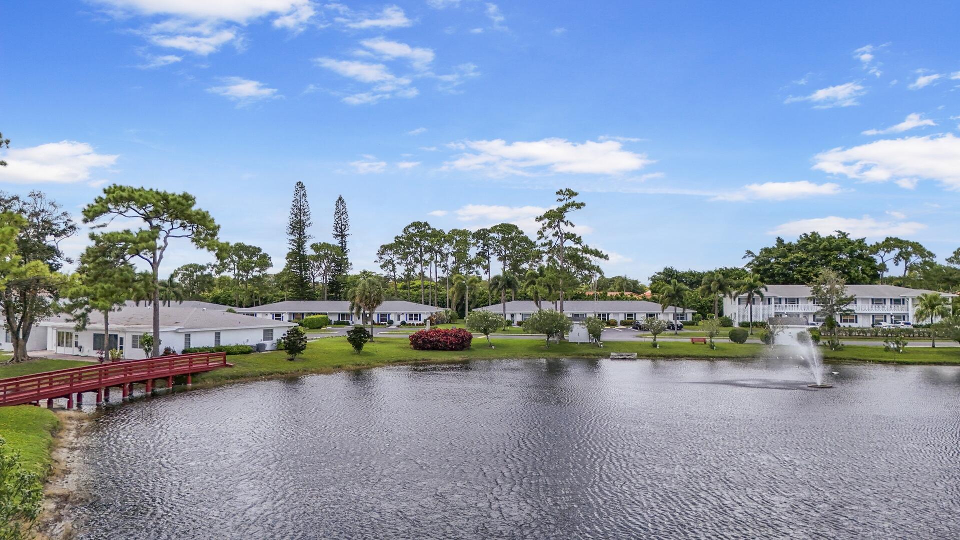 5222 Privet Place, Unit B Delray Beach, FL 33484 - Photo 22 of 27 a view of swimming pool and lake view