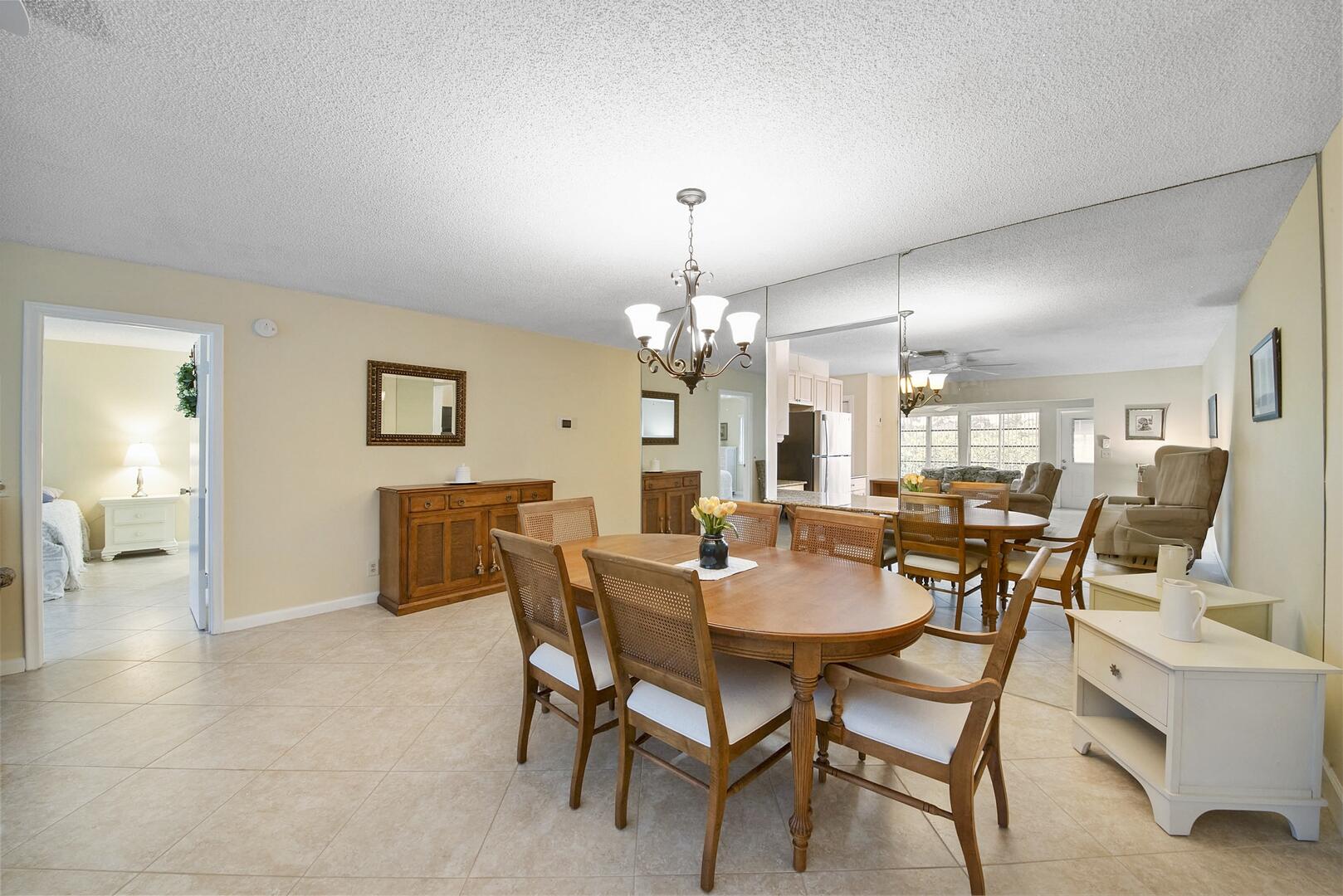 5222 Privet Place, Unit B Delray Beach, FL 33484 - Photo 6 of 27 a dining room with furniture and window