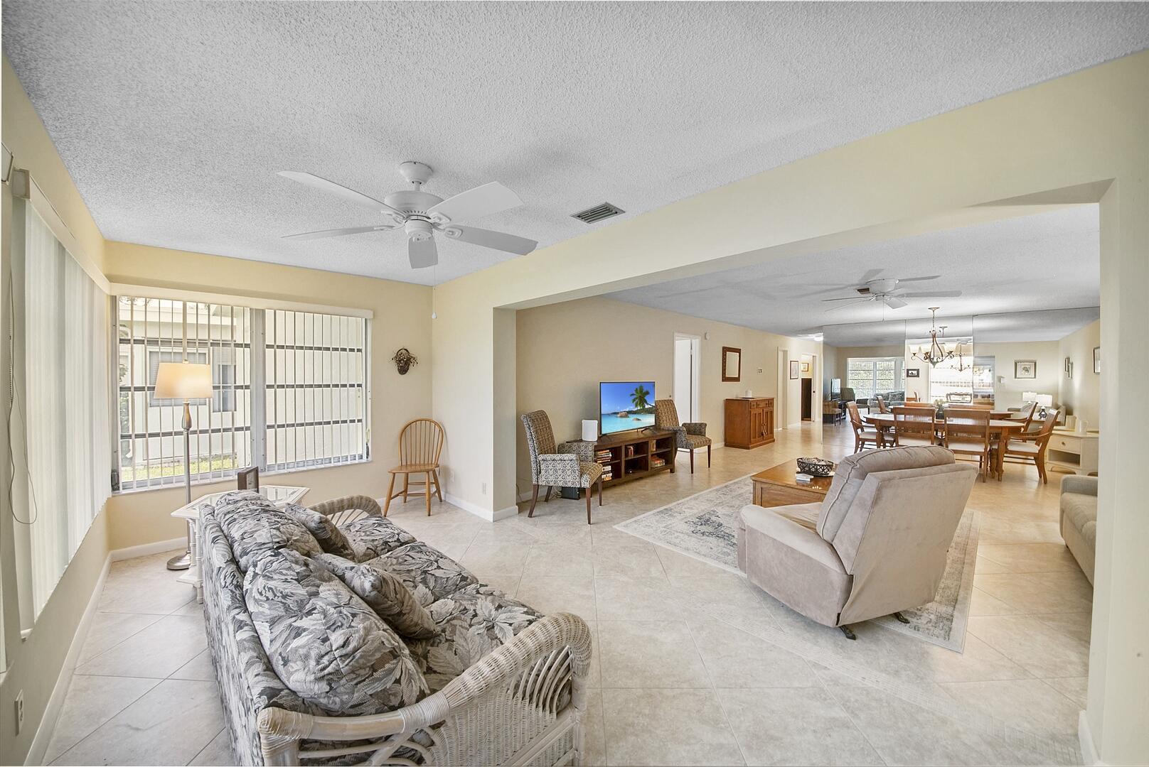5222 Privet Place, Unit B Delray Beach, FL 33484 - Photo 7 of 27 a living room with furniture and a large window