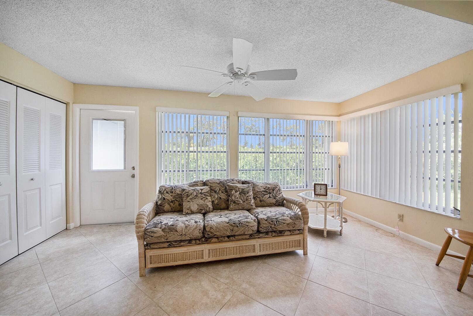 5222 Privet Place, Unit B Delray Beach, FL 33484 - Photo 8 of 27 a living room with furniture and a window