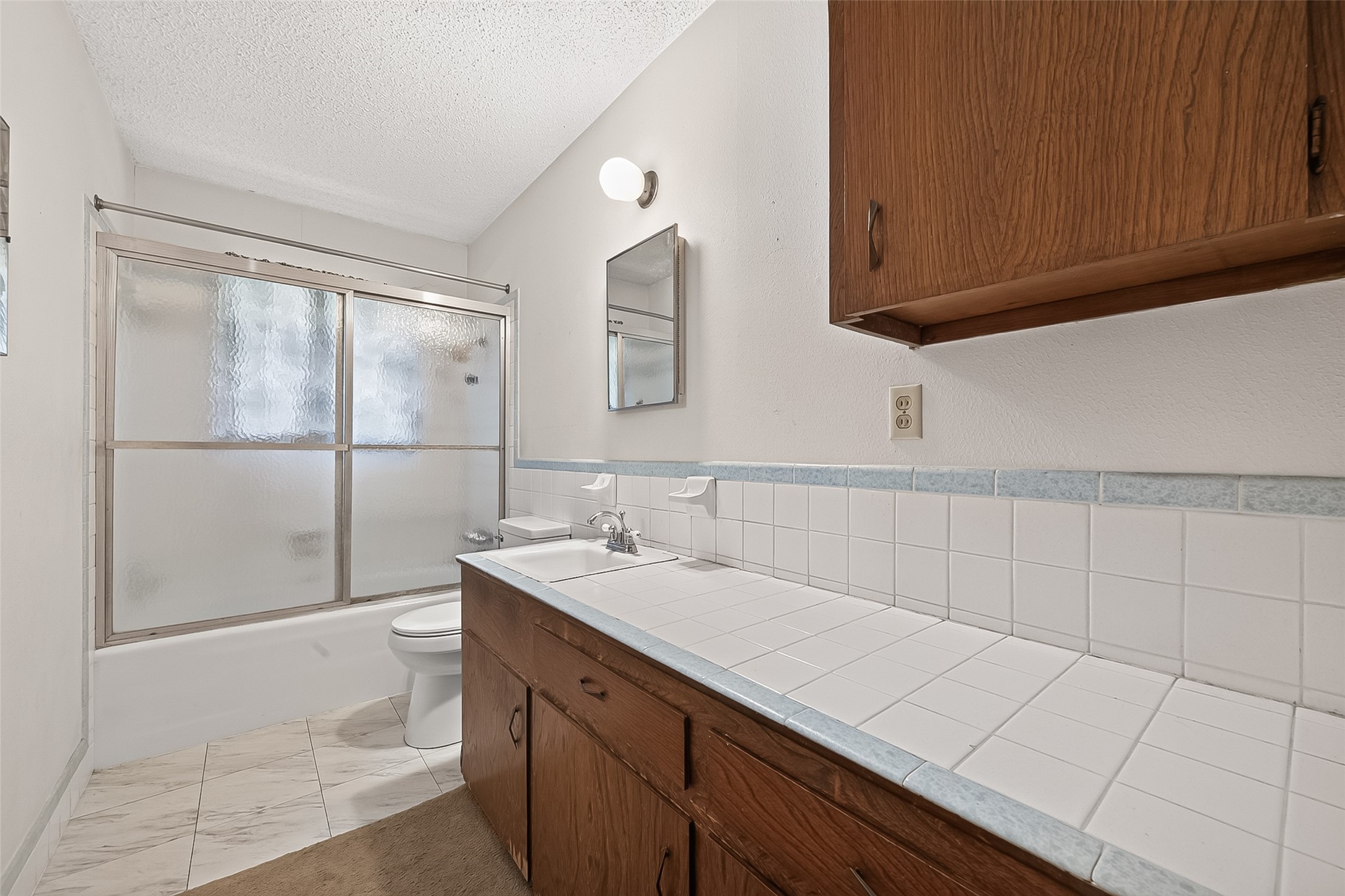 11105 Needville Fairchilds Road Needville, TX 77461 - Photo 16 of 24 a bathroom with a sink and a mirror