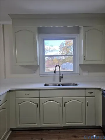 a close view of sink and cabinets