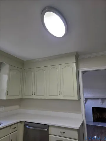 a kitchen with cabinets and a fireplace