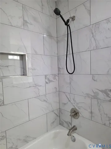 a bathroom with a bath tub