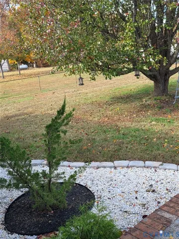 a view of yard with large trees